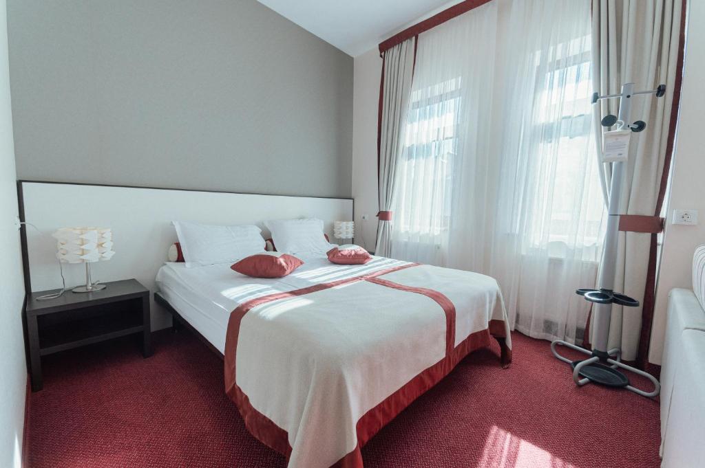 Postel nebo postele na pokoji v ubytování Boutique Hotel Palais Royal