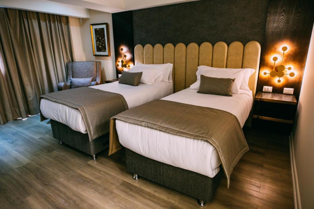 Postel nebo postele na pokoji v ubytování Hotel HW High Wellness