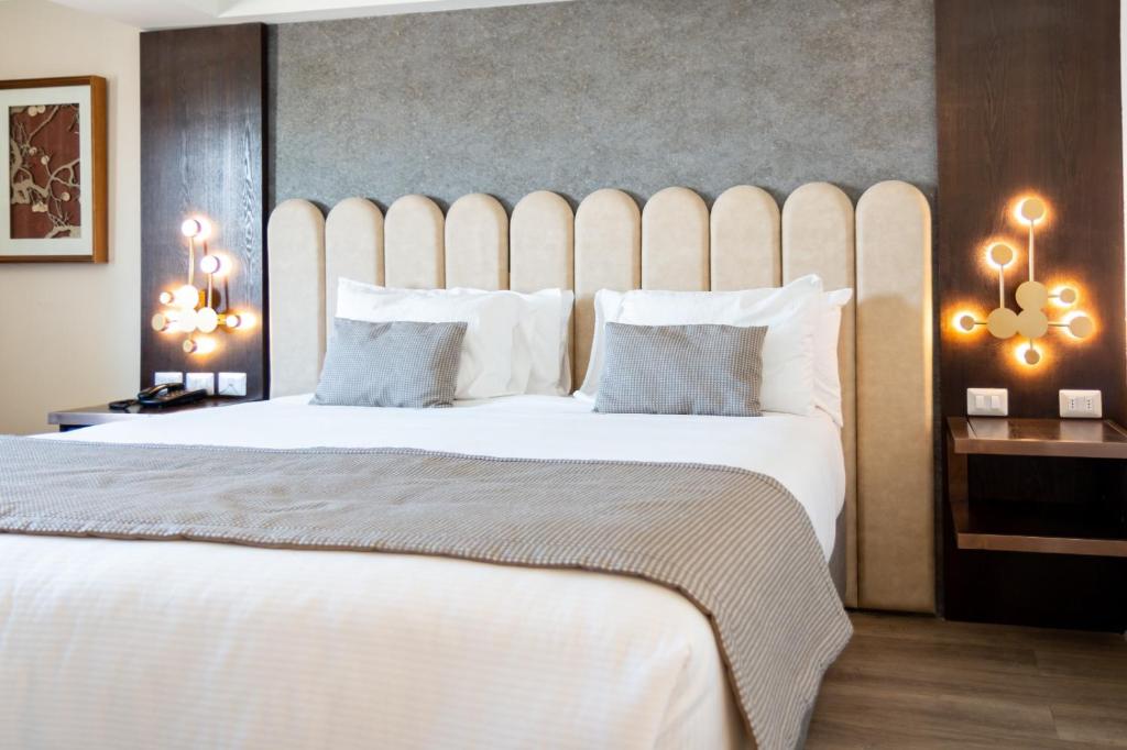 Postel nebo postele na pokoji v ubytování Hotel HW High Wellness