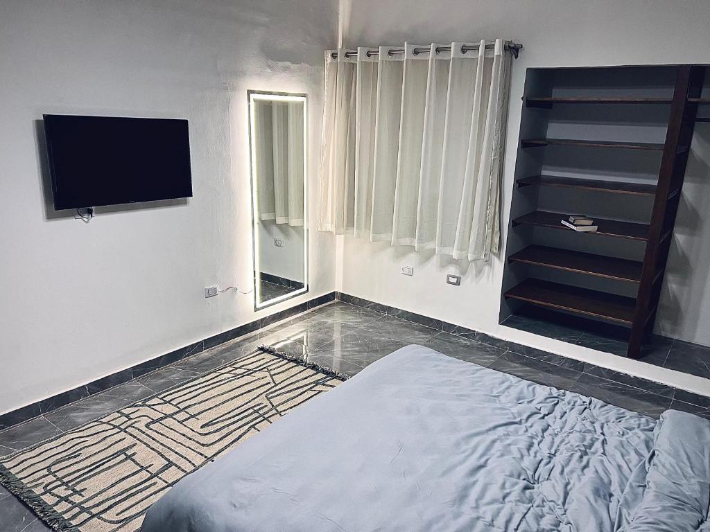 Postel nebo postele na pokoji v ubytování Maadi Groove Guesthouse