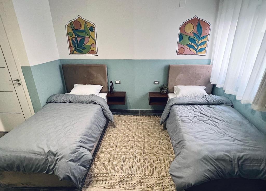 Postel nebo postele na pokoji v ubytování Maadi Groove Guesthouse