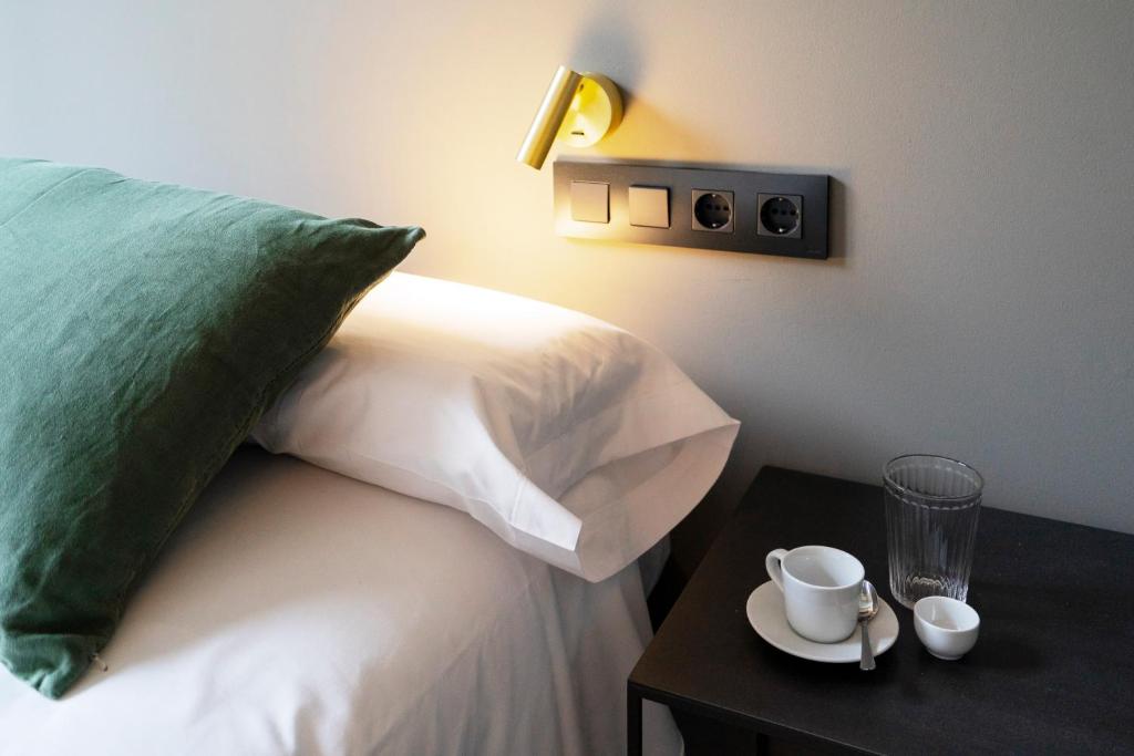 Postel nebo postele na pokoji v ubytování Hostal Porxos Garden