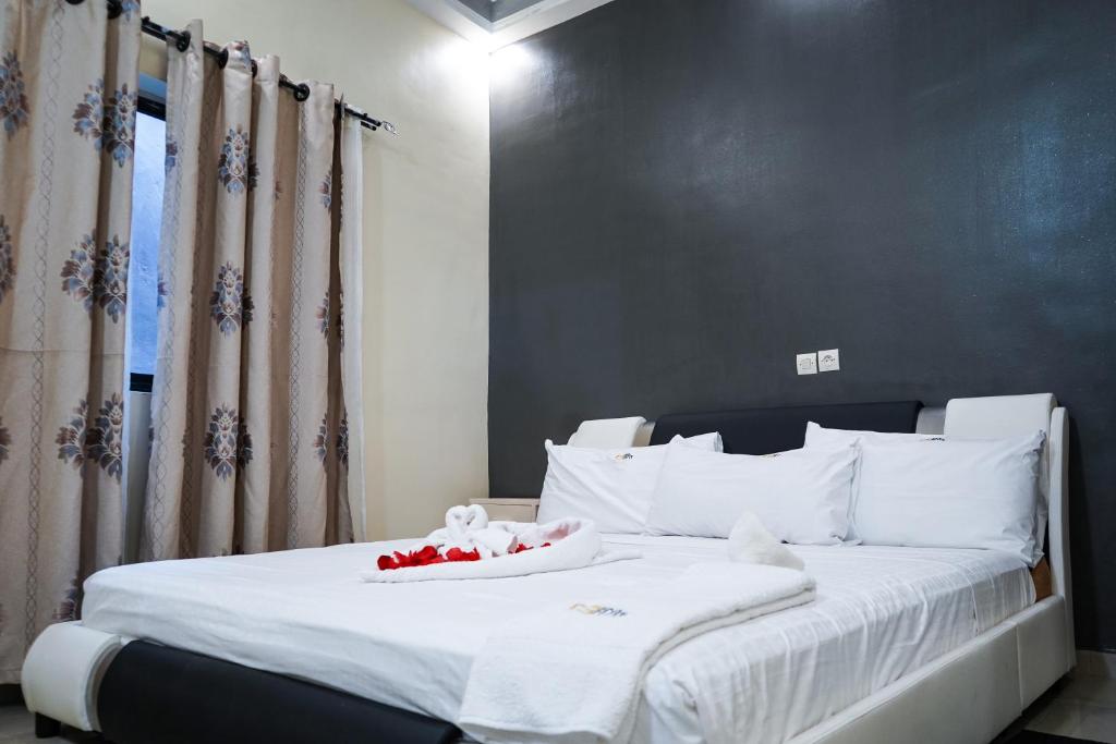 Postel nebo postele na pokoji v ubytování EKA ELITE HOTEL