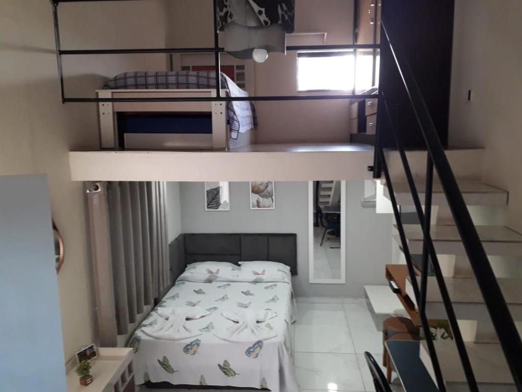 a room with two bunk beds and a staircase at Casa do Henrique 1 in Sorocaba