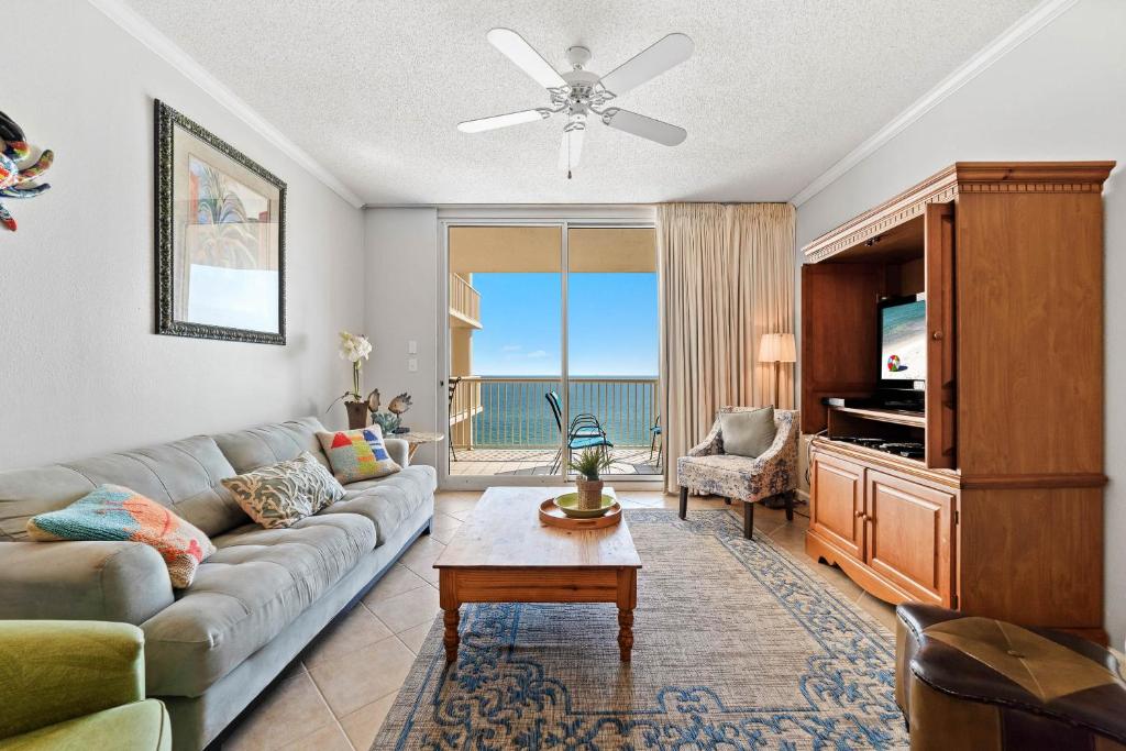 a living room with a couch and a table at Beach Club Avalon 1204 in Gulf Highlands