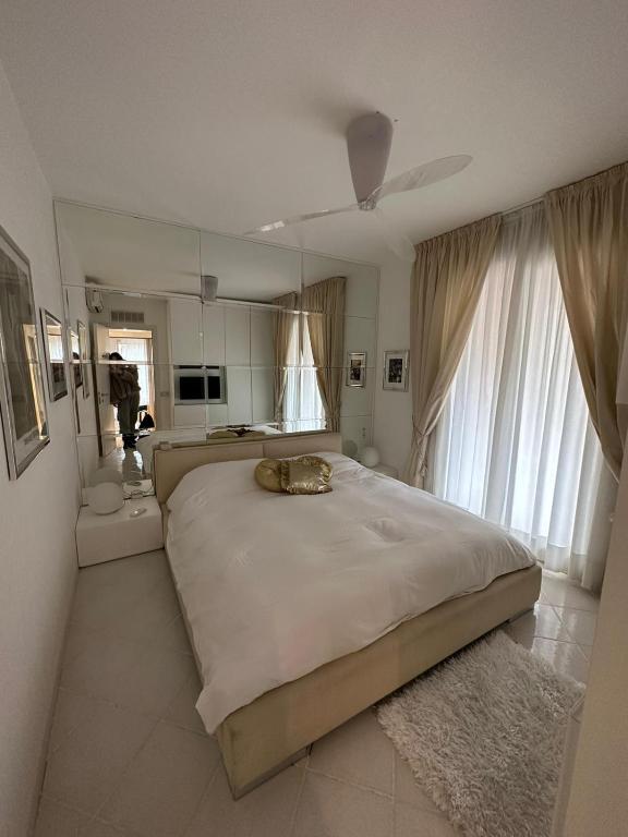 Posteľ alebo postele v izbe v ubytovaní Condominio Imperiale