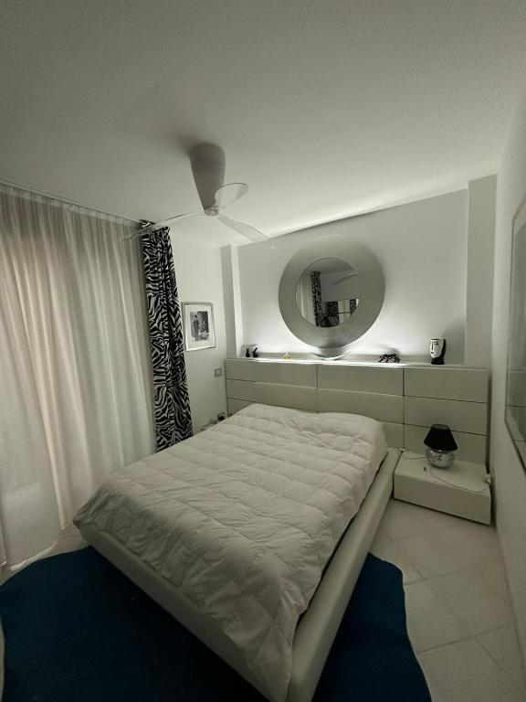 Posteľ alebo postele v izbe v ubytovaní Condominio Imperiale