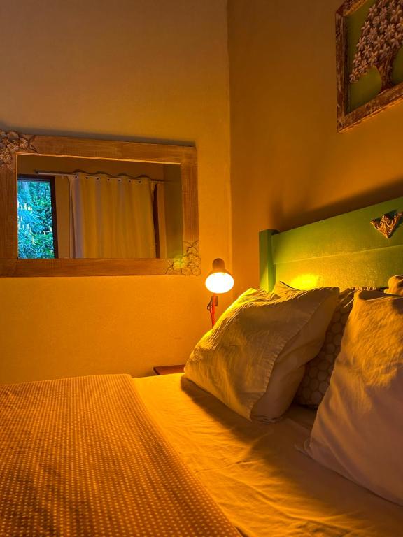 Postel nebo postele na pokoji v ubytování Chalé Ouro Verde