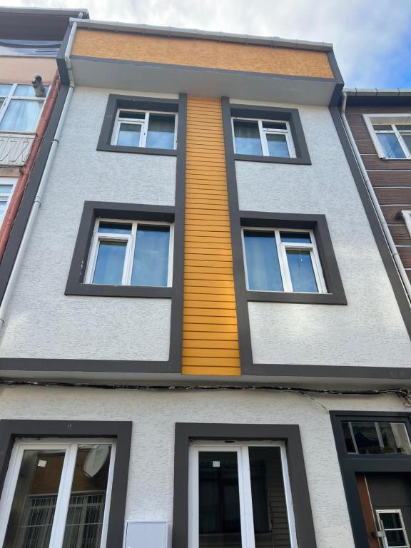 a building with a yellow stripe on the side of it at Zerya suites in Istanbul