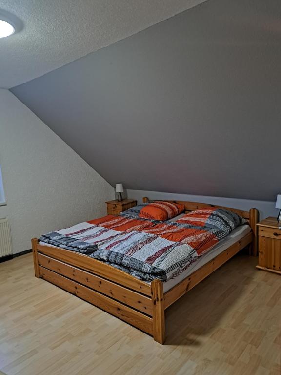 a bedroom with a bed in a room at Pension 3 Ferienhof Hanstorf in Satow