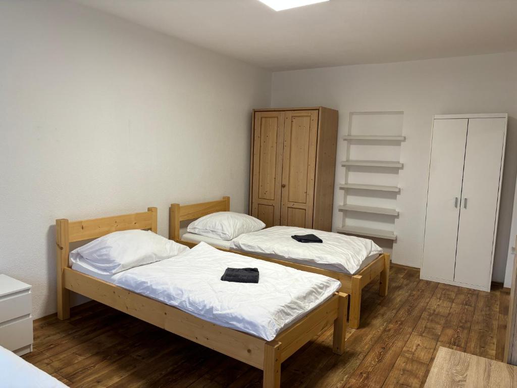Postel nebo postele na pokoji v ubytování Apartmány Zahradní