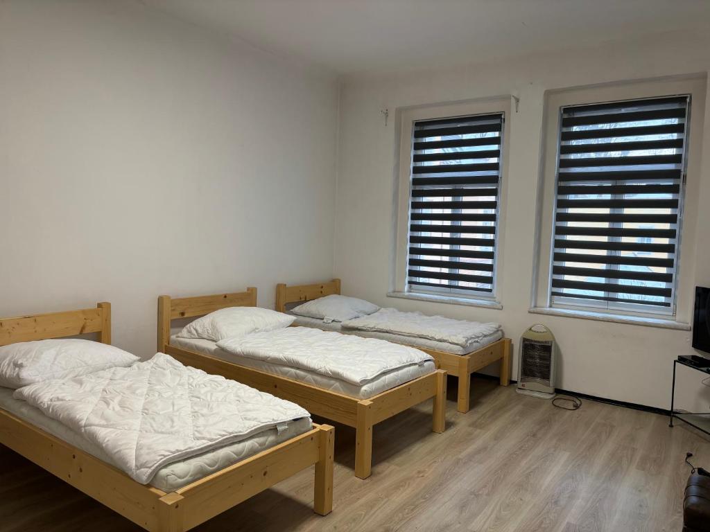 Postel nebo postele na pokoji v ubytování Apartmány Zahradní