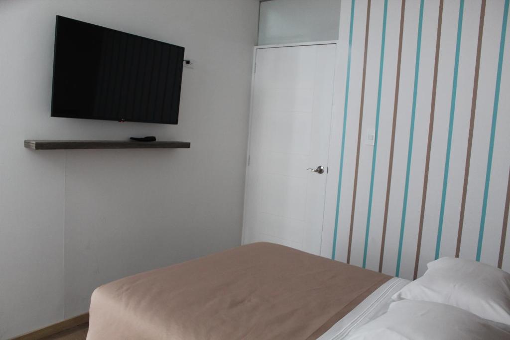 Postel nebo postele na pokoji v ubytování Basadre Apart Hotel