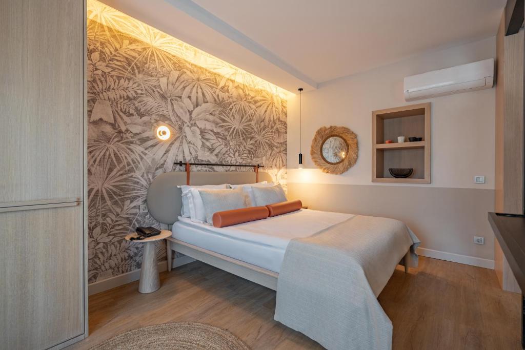 Postel nebo postele na pokoji v ubytování Oli Hotel and Suites