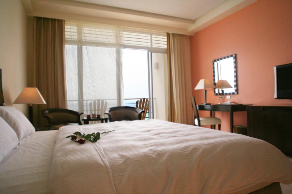 Letto o letti in una camera di Chateau Beach Resort Kenting