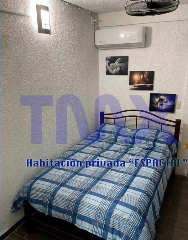 Letto o letti in una camera di TMX HOSTAL