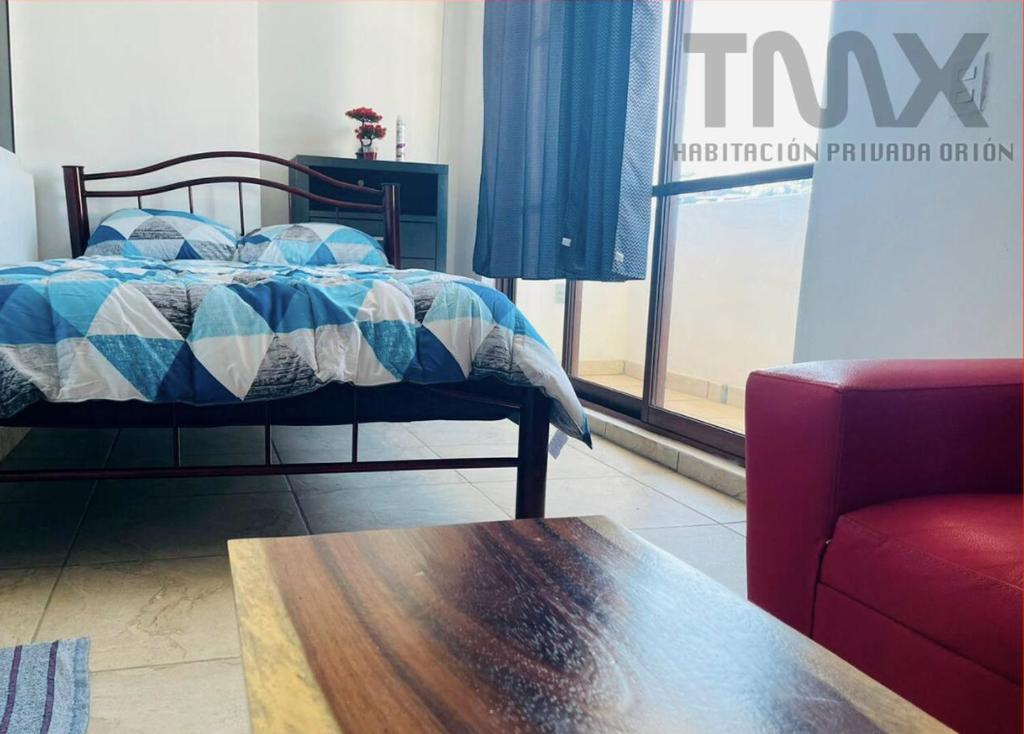 Letto o letti in una camera di TMX HOSTAL