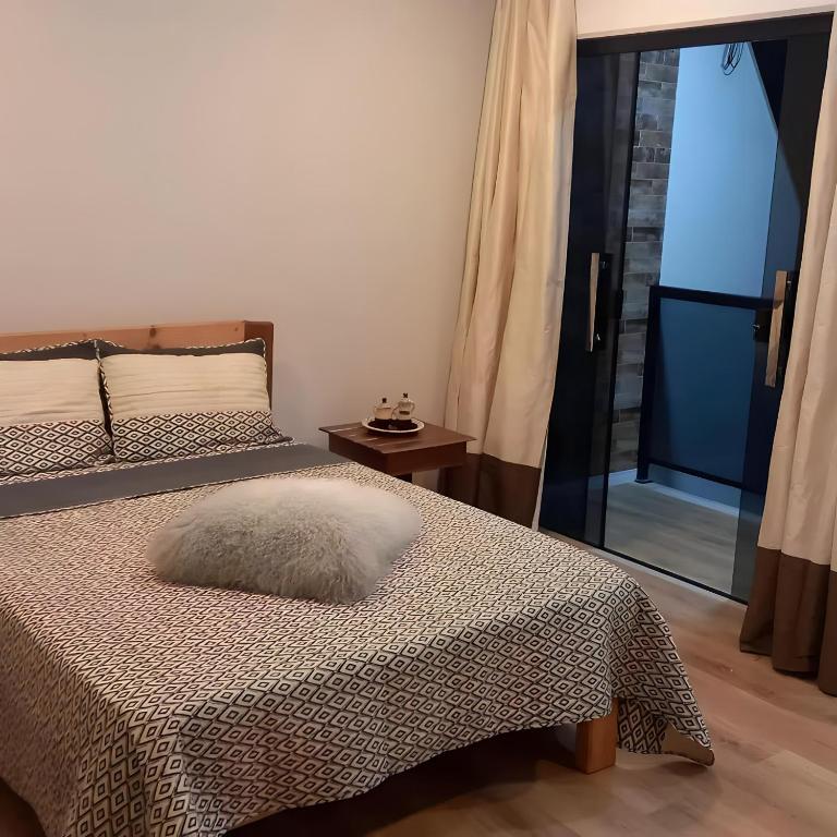 Postel nebo postele na pokoji v ubytování Recanto dos Sonhos
