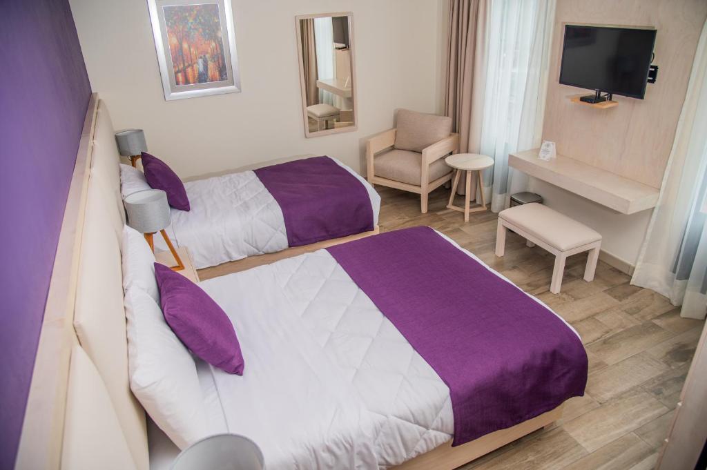 Postel nebo postele na pokoji v ubytování Quinta Mercedes