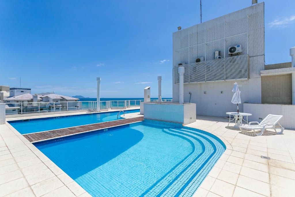 La alberca dentro o cerca de Aquarelle by Viva - Prédio nos Ingleses pé-na-areia com piscina