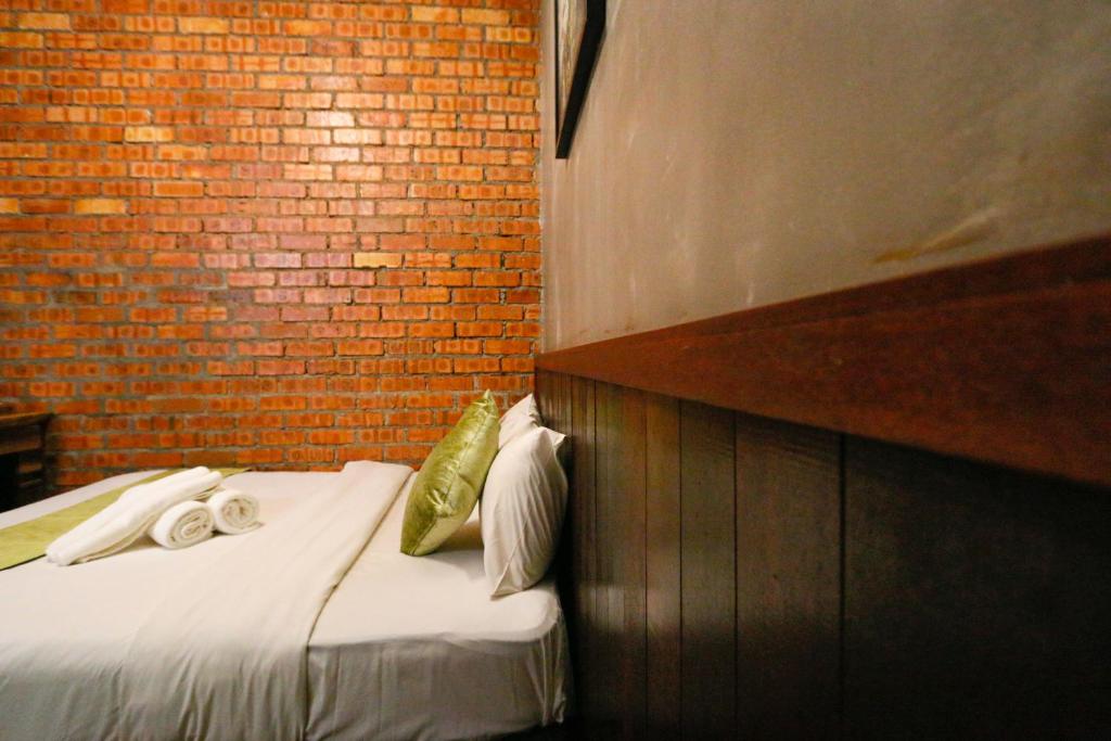 Postel nebo postele na pokoji v ubytování Anggun Hotel