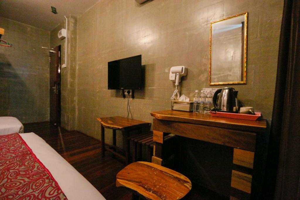 Postel nebo postele na pokoji v ubytování Anggun Hotel
