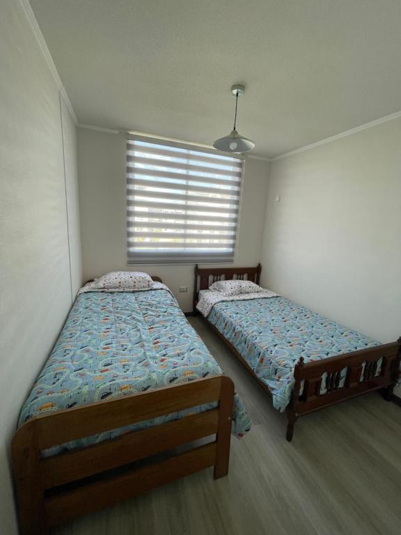 Кровать или кровати в номере Departamento La Serena