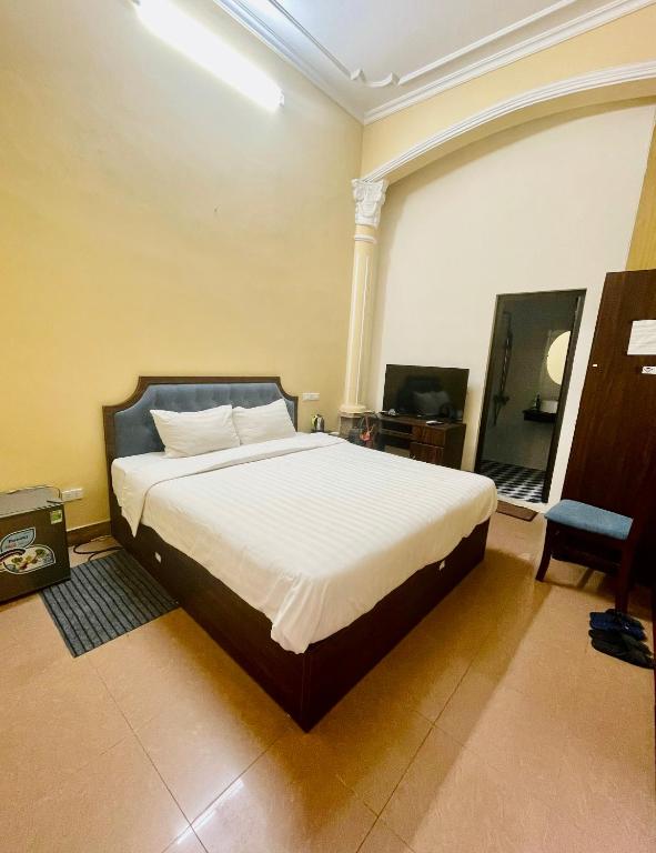 Postel nebo postele na pokoji v ubytování Hanoi Hidden Guest House