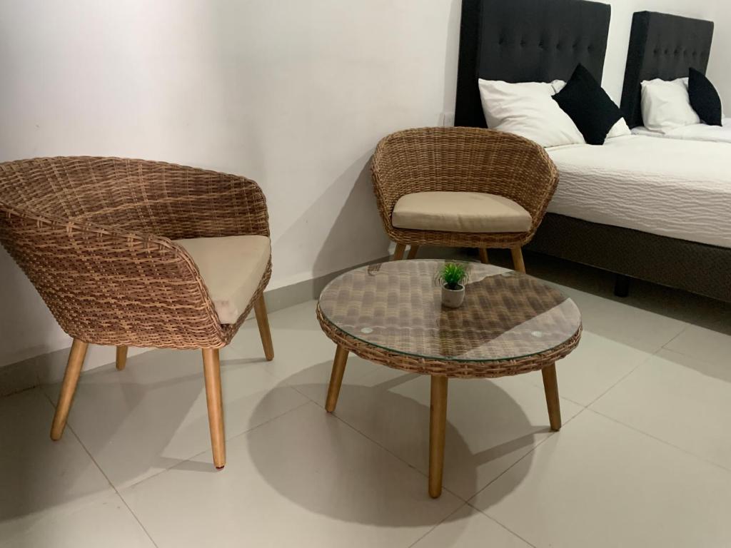 Postel nebo postele na pokoji v ubytování HOTEL SOÍ BACALAR