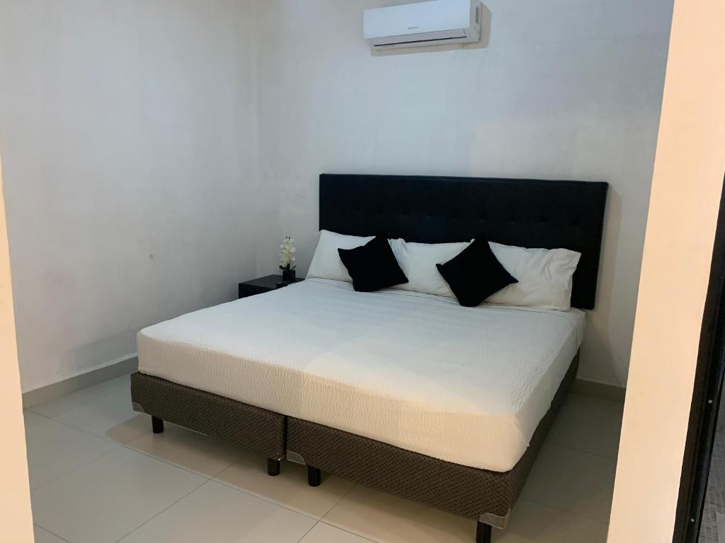 Postel nebo postele na pokoji v ubytování HOTEL SOÍ BACALAR