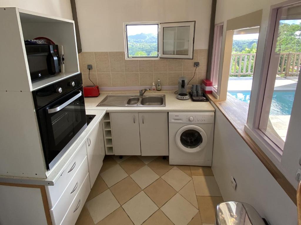 Kuchyň nebo kuchyňský kout v ubytování Appartement T2 B - vue campagne
