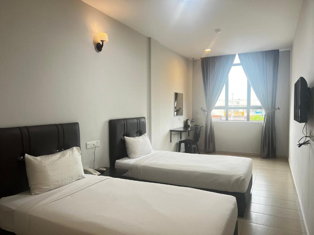 Postel nebo postele na pokoji v ubytování SiN LiEN HOTEL