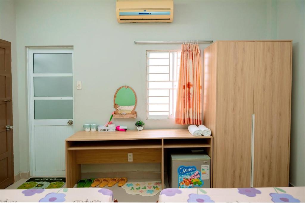 a childs bedroom with a desk and a closet at Lucky Home in Nha Trang
