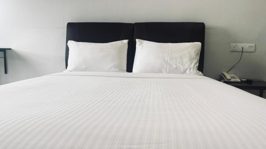 Postel nebo postele na pokoji v ubytování SiN LiEN HOTEL