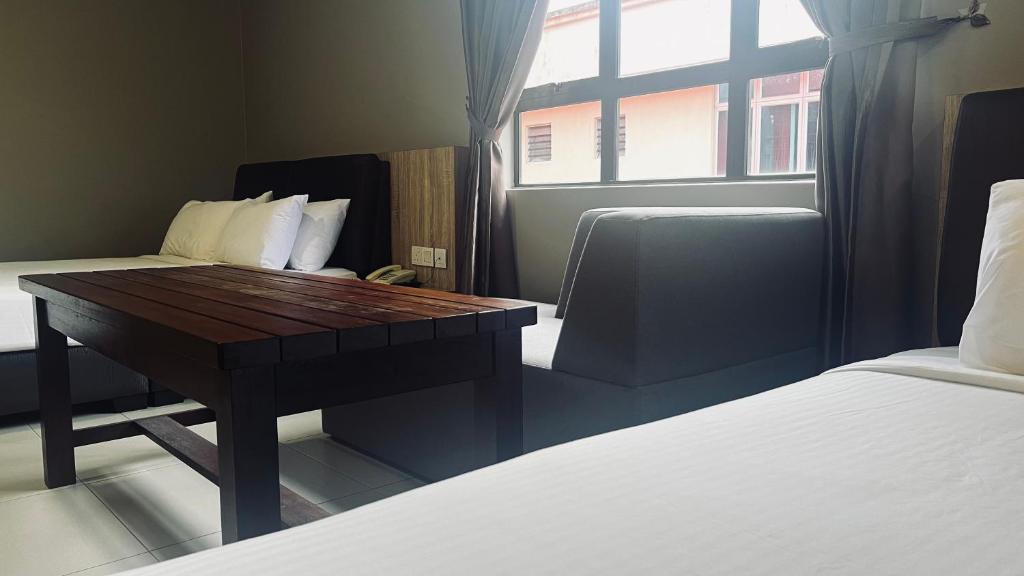 Postel nebo postele na pokoji v ubytování SiN LiEN HOTEL
