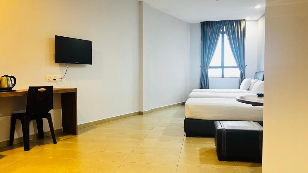Postel nebo postele na pokoji v ubytování SiN LiEN HOTEL