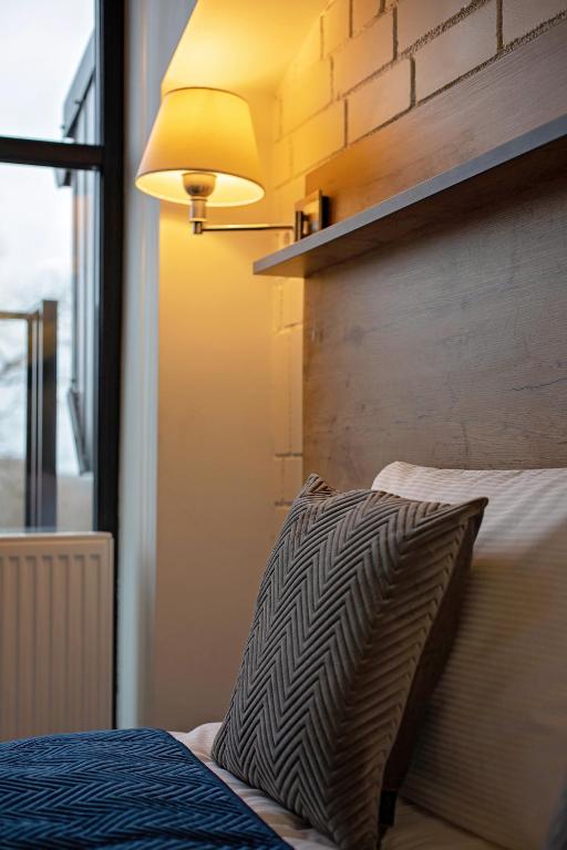 Postel nebo postele na pokoji v ubytování Loft Inn SELF-CHECK IN