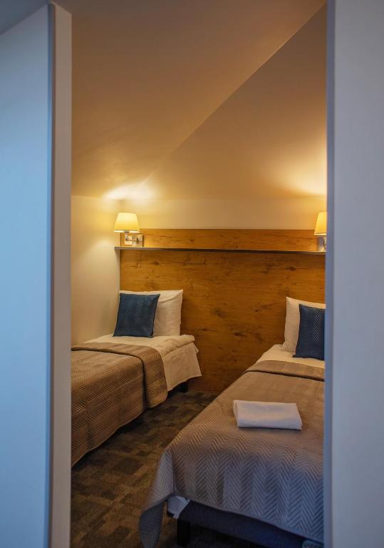 Postel nebo postele na pokoji v ubytování Loft Inn SELF-CHECK IN