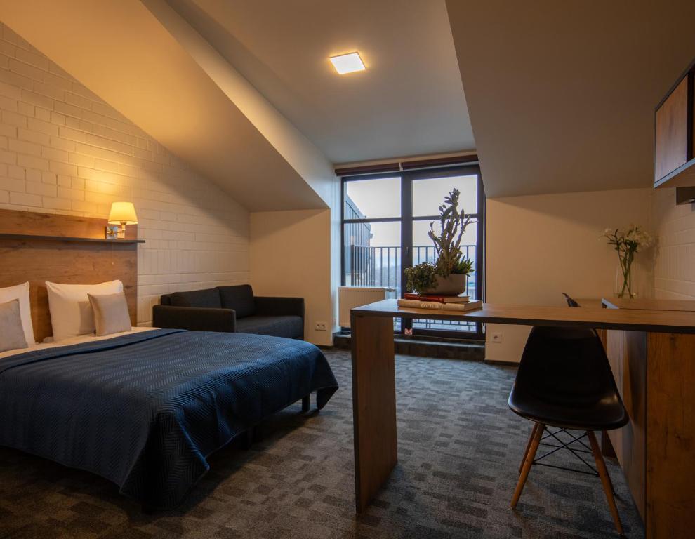 Postel nebo postele na pokoji v ubytování Loft Inn SELF-CHECK IN
