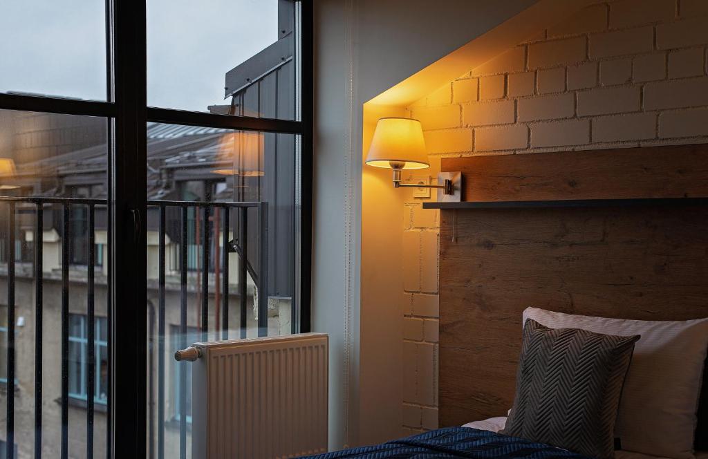 Postel nebo postele na pokoji v ubytování Loft Inn SELF-CHECK IN