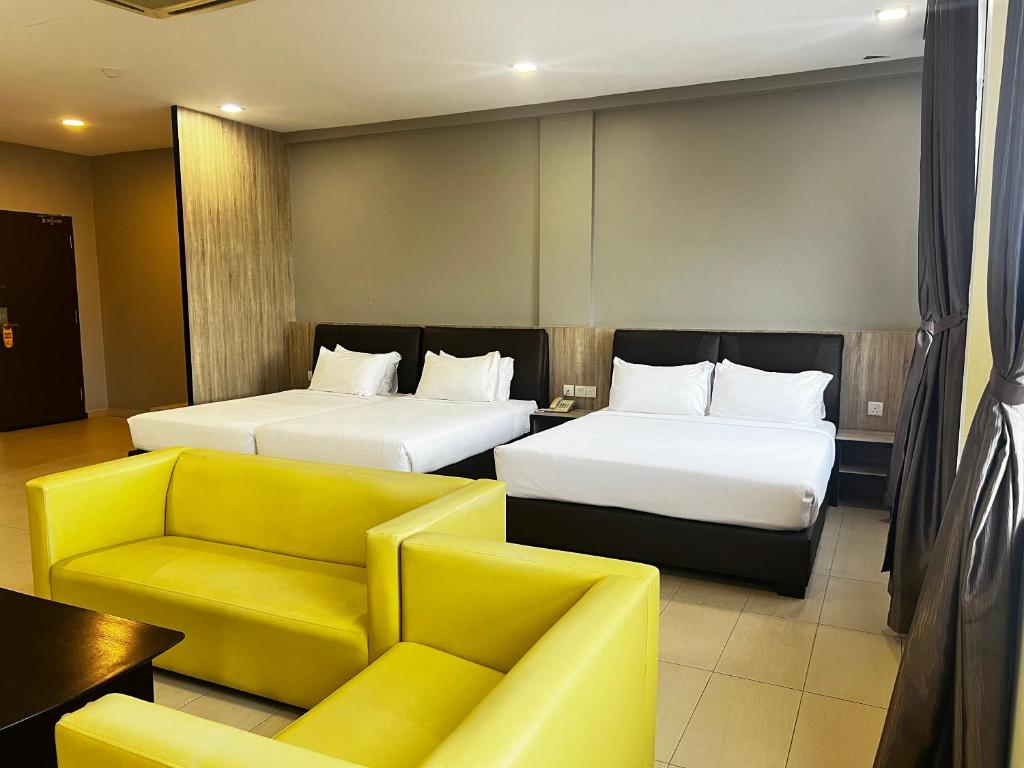 Postel nebo postele na pokoji v ubytování SiN LiEN HOTEL
