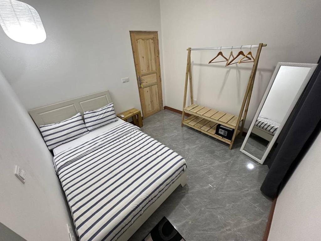 Postel nebo postele na pokoji v ubytování Nasreenuvilla