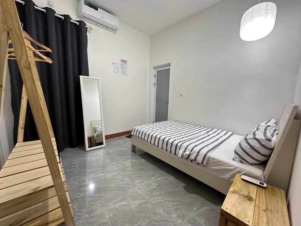 Postel nebo postele na pokoji v ubytování Nasreenuvilla