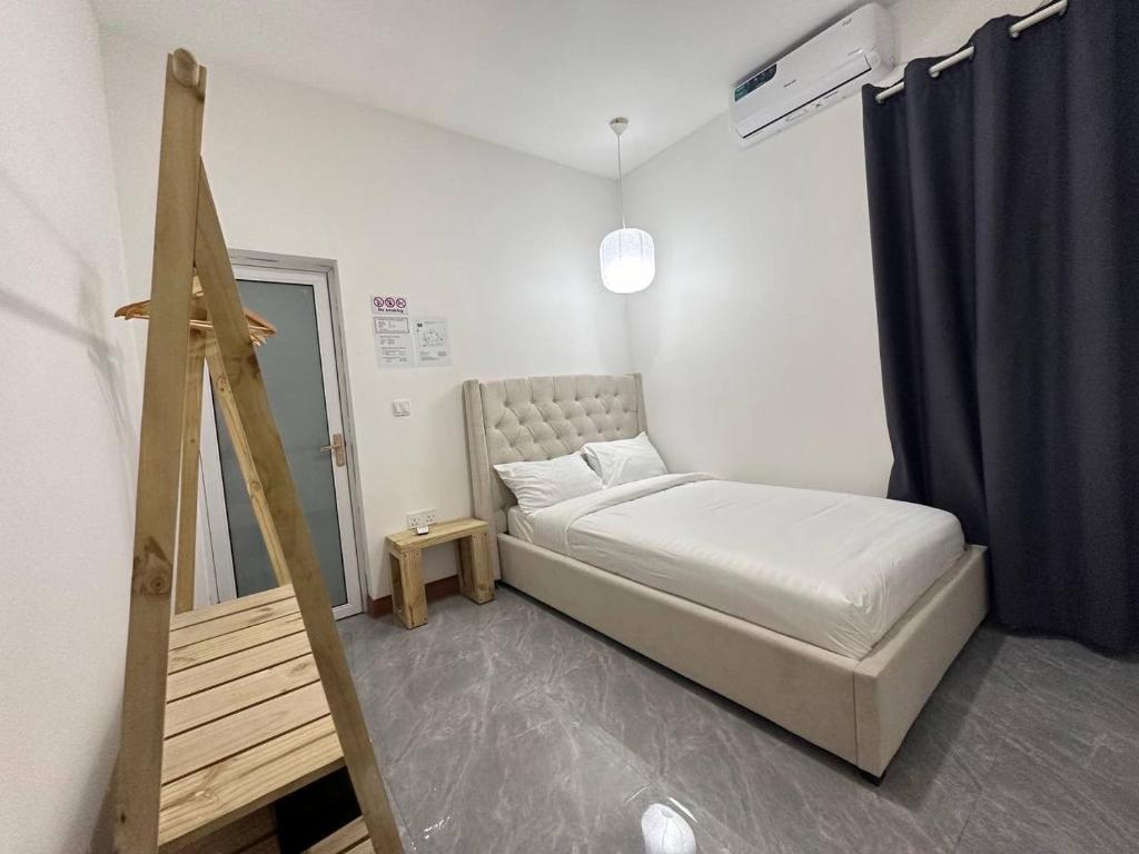 Postel nebo postele na pokoji v ubytování Nasreenuvilla