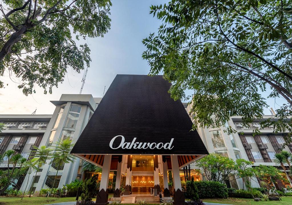 a building with a black awning with the word oxford at Oakwood Hotel & Apartments Taman Mini Jakarta in Jakarta