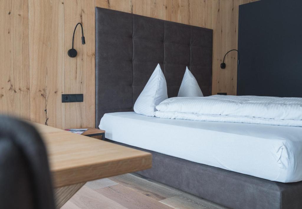 Postel nebo postele na pokoji v ubytování ad-fontanas Appartements Vandans