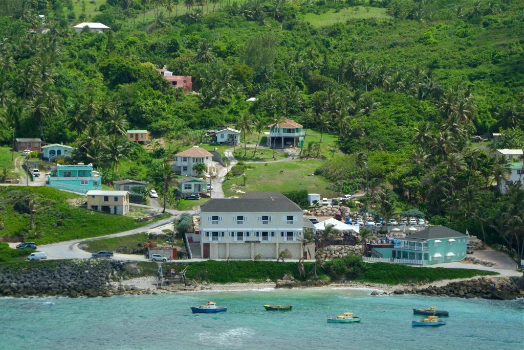 an island with houses and boats in the water at The Atlantis Historic Inn in Saint Joseph