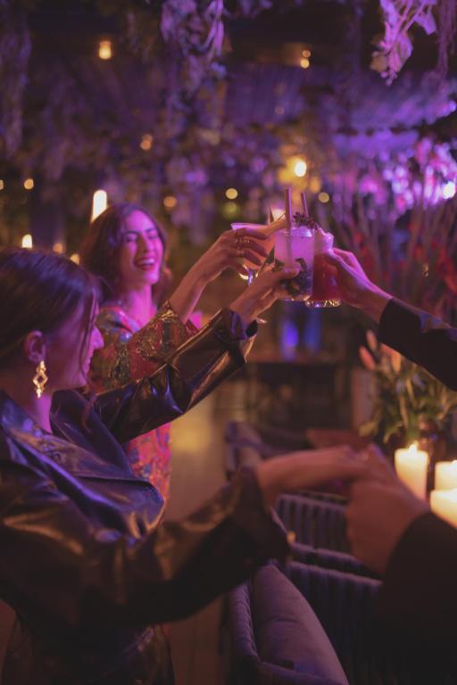 a group of people raising their glasses at a party at The View Agadir in Agadir