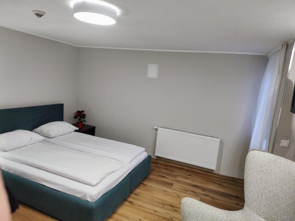 Postel nebo postele na pokoji v ubytování Boutique Hotel's III Piłsudskiego