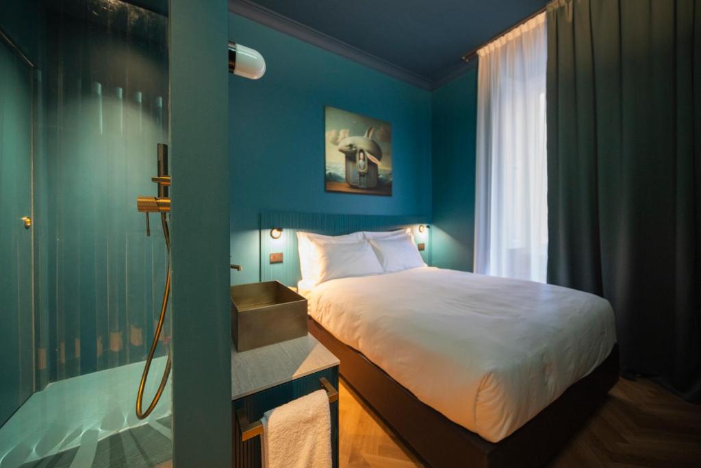 Postel nebo postele na pokoji v ubytování Fontana 16 Rooms